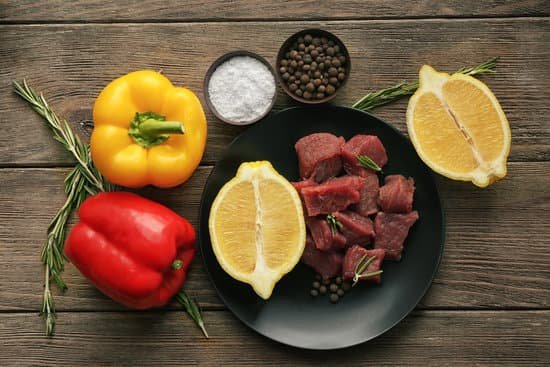 canva raw meat with spices and vegetables on table MAD Q 42kcQ