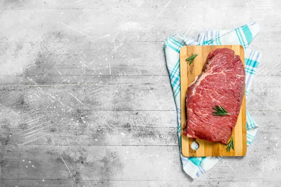 canva raw meat. fresh beef on a cutting board with napkin. MAEPkbIP014