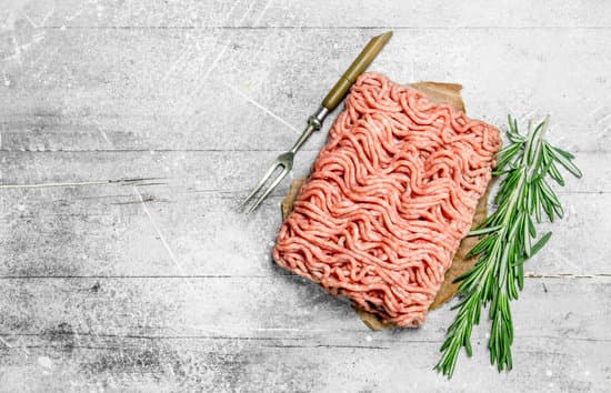 canva raw minced meat with rosemary branches . MAEPUg6RUUw
