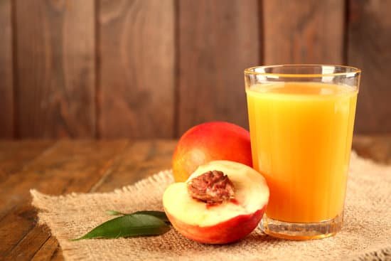 canva ripe peaches and glass of juice close up MAD MldG8l8