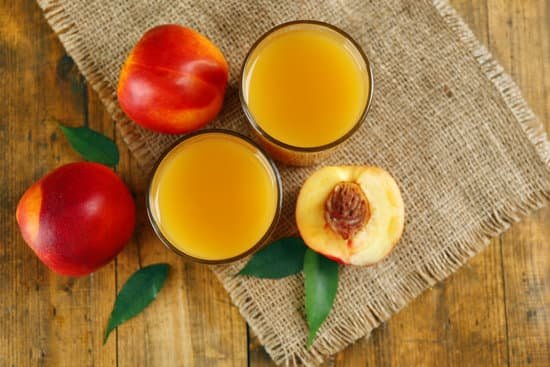 canva ripe peaches and glasses of juice top view MAD MnHsTo8