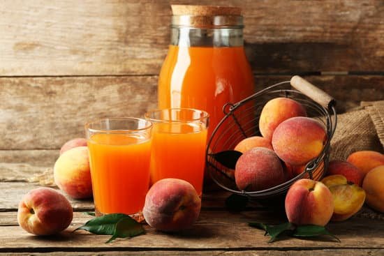 canva ripe peaches and juice on wooden background MAD MsNmID8