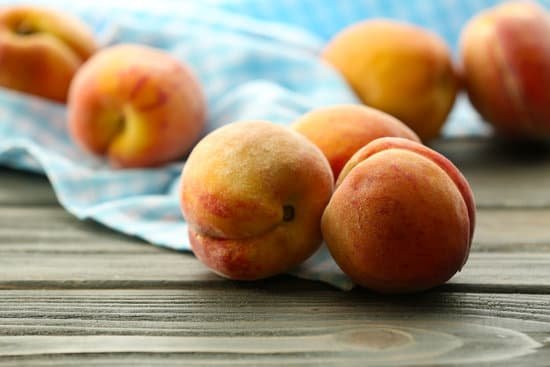 canva ripe peaches on table MAD MXYLhtc