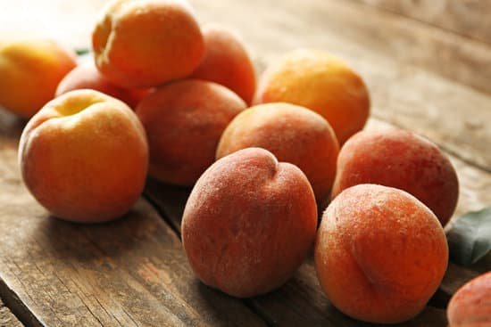 canva ripe peaches on wooden background MAD Mrz3jLw