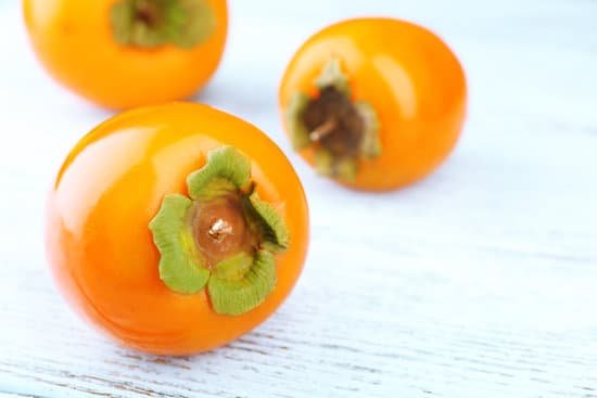 canva ripe persimmons on wooden background MAD L8FU r4