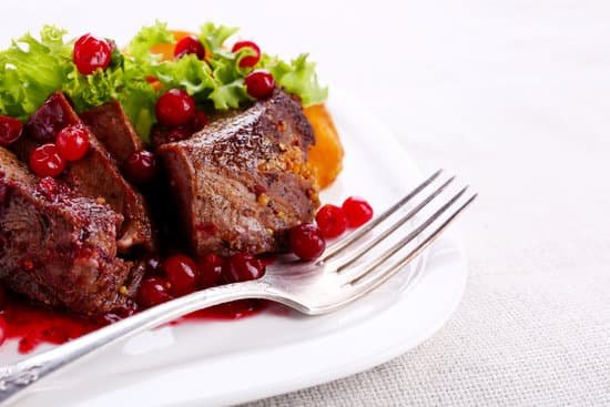 canva roasted meat with cranberry sauce and vegetables MAD MbPkQIo