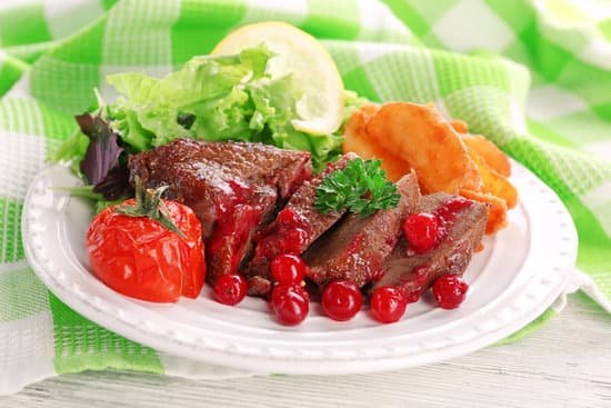 canva roasted meat with cranberry sauce assorted vegetables and potatoes MAD MdMsOCM