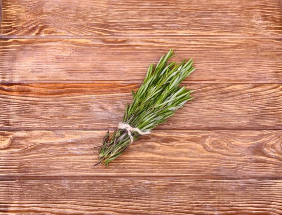 canva rosemary bound on a wooden board MAEPRso80eI