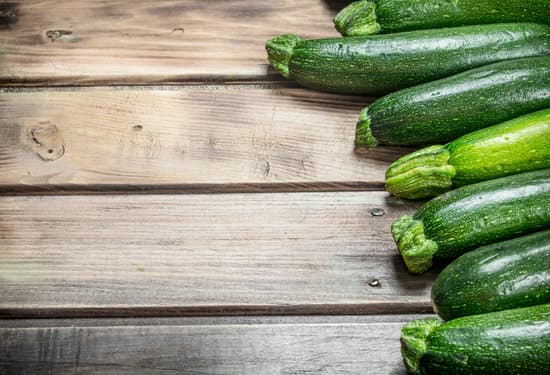 canva row of zucchini on wooden background MAEPnsUgatA