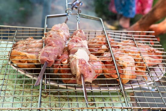 canva skewers with pork meat on barbecue grill MAESjOCQo9A