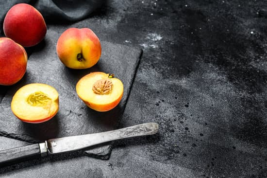 canva sliced peaches in a wooden bowl MAERJ1Y4YFw