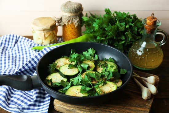 canva sliced zucchini in a pan MAD MdNrGa8