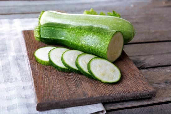 canva sliced zucchinis on wooden board MAD MUJr7lo