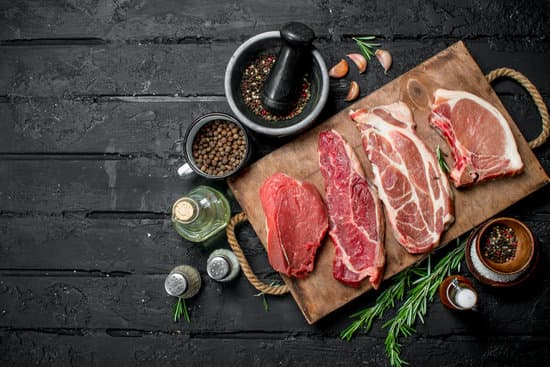 canva slices of meat on a wooden tray flatlay MAEPiWY4ORM