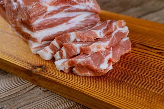 canva slices of raw meat on wooden cutting board MAEDmQpRbEM