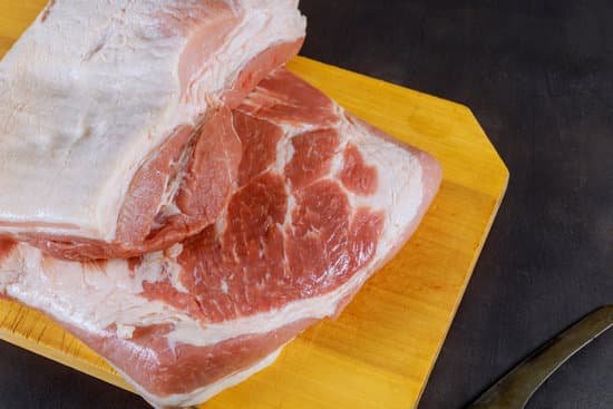 canva slices of raw meat on wooden cutting board MAEDmsmfhDo