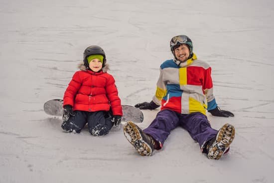 canva snowboard instructor teaches a boy to snowboard MAELB oQiW8