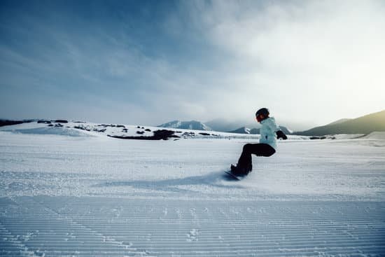 canva snowboarder descent on winter ski resort slope MAC4WLrkefc