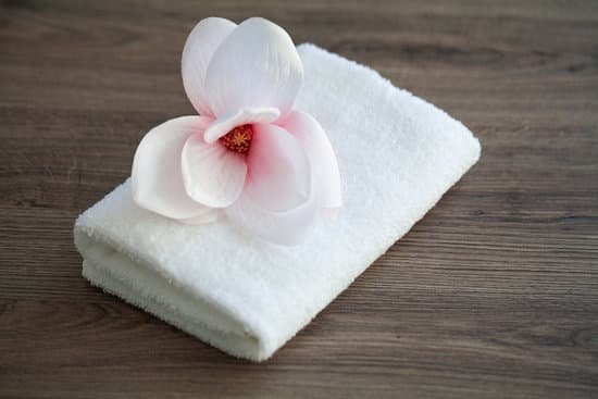 canva spa orchid with soft towels on wooden table MAD8iuEh3dc