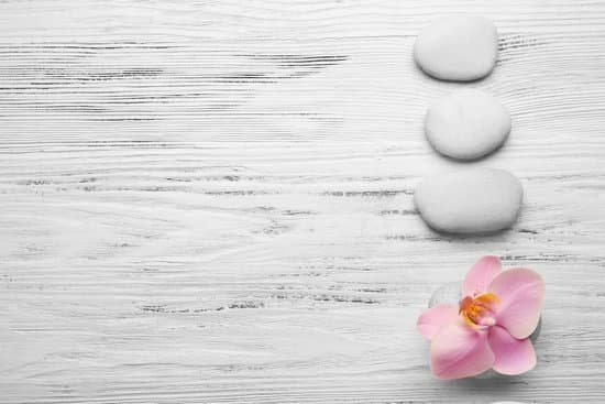 canva spa stones and orchid flower on wooden background MAD Qq2qfnw