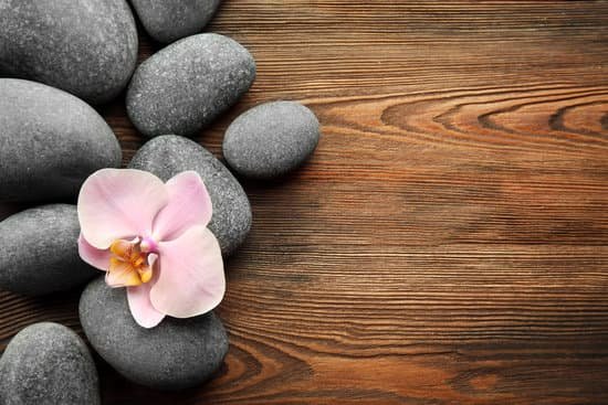 canva spa stones and orchid flower on wooden surface MAD QuCd 4U