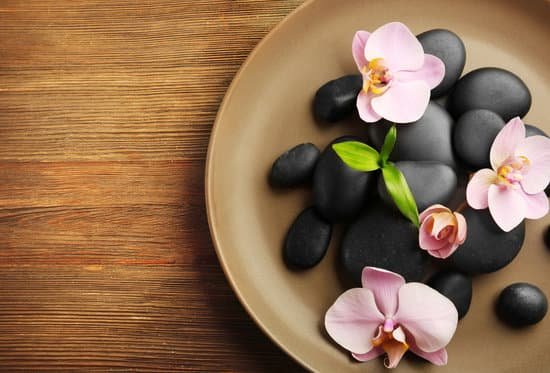 canva spa stones and orchid flowers in round plate top view MAD Qo2 yKA