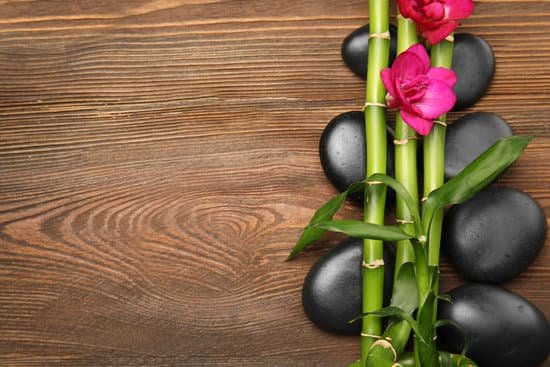 canva spa stones and orchids on wooden background MAD QqioBl8