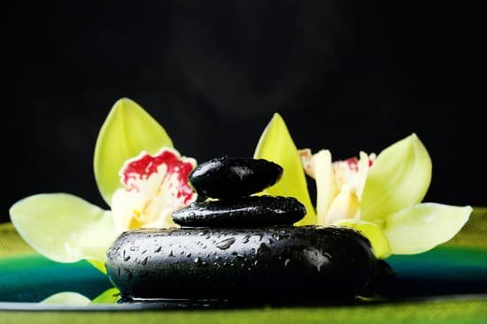 canva spa stones with steam and orchids in water MAD MDM9M1g