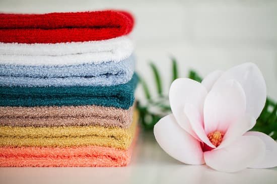 canva stack of towels and orchid MAD8ihXgQew