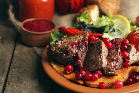 canva tasty roasted meat with cranberry sauce MAD