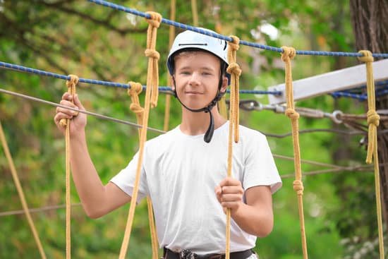 canva teenage boy climbing in adventure park MAD9UCyrsoQ