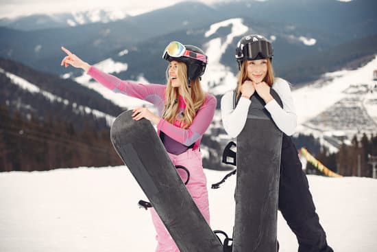 canva two happy women in jacket and helmet with snowboards outdoors MAEWQDs4zeI