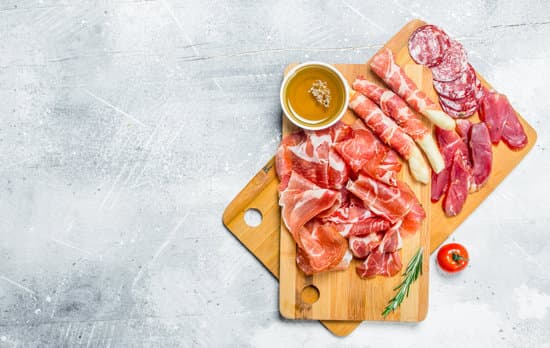 canva various meats on wooden cutting boards MAEQIXh6q0s