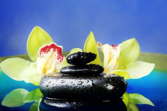 canva wet spa stones and orchids in water MAD MEX0Y3E