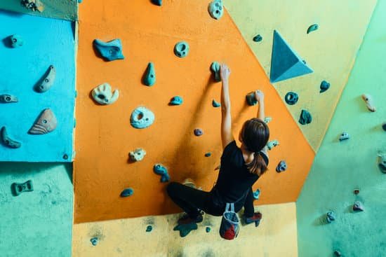 canva woman climbing up on practice wall MADyU53vJl8