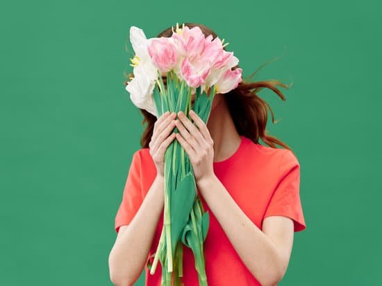 canva woman covering face with tulip bouquet MAD6rrzIKbw