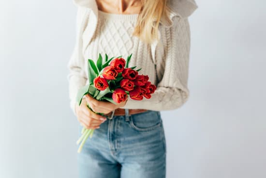 canva woman holding a bouquet of tulips MAEXIqFL27U