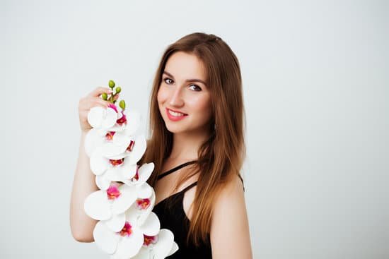 canva woman holding orchids MAEAsg6DHuo