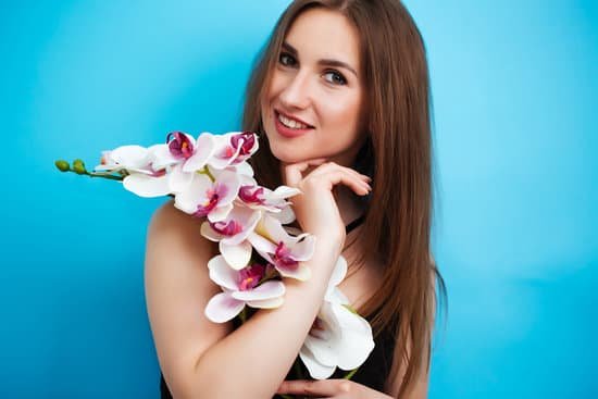 canva woman in bathing suit holding orchid MAEB1110Zck