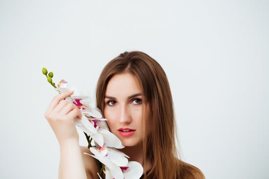 canva woman in bathing suit holding orchid MAEB19H0oRA