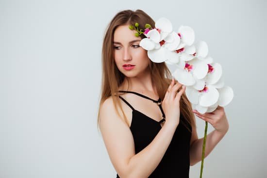 canva woman in bathing suit holding orchid MAEB1 P GwQ