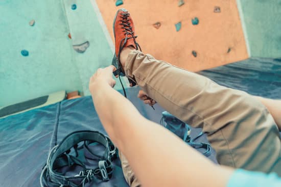 canva woman putting on climbing shoes MAEgOLvuLKE