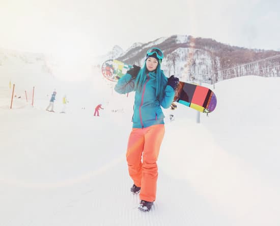 canva woman with snowboard on ski resort MAEbbyQA3fo