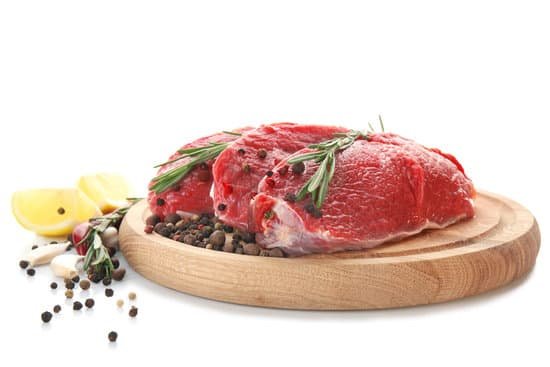 canva wooden board with fresh raw meat and spices MAD9Tl1Tak0