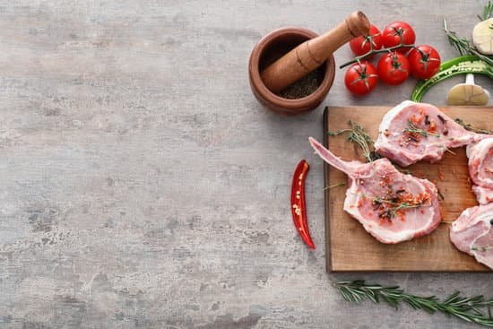 canva wooden board with fresh raw meat on table MAD9T2FkOw8