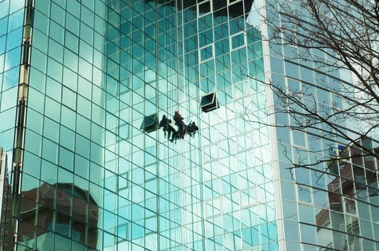 canva worker climbing at mirror wall MADauCfeGp0