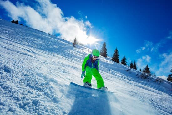 canva young boy snowboarding on a ski slope MAD gdIddJQ