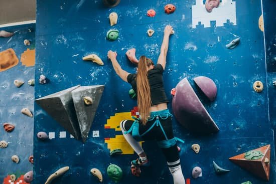 canva young woman climbing a tall indoor man made rock climbing wall MAEBcWtzlJ0