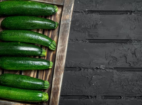 canva zucchinis on wooden board flatlay MAEPy88tJ4s