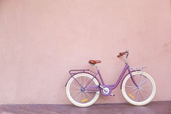 canva a violet bicycle by a wall MAD9T3ufYvE